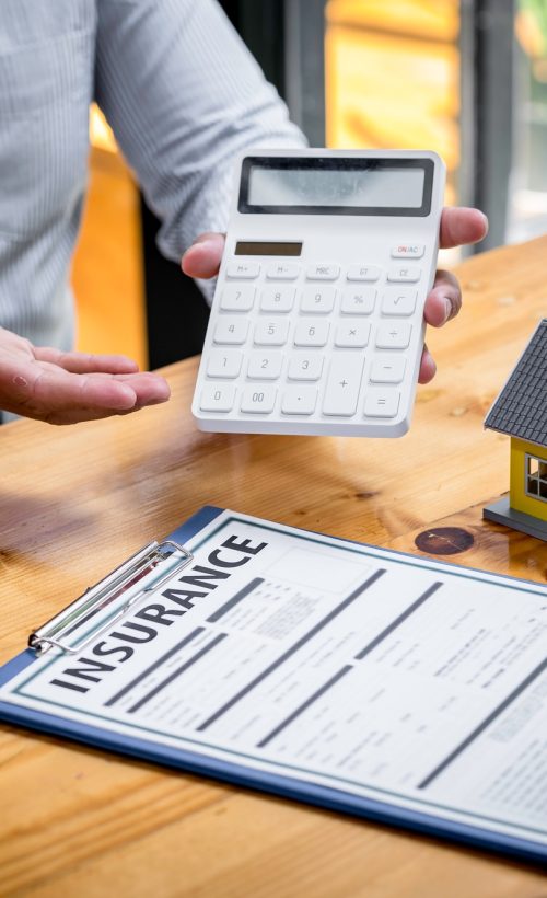 Insurance agent broker man holding document and present pointing showing an insurance policy contrac